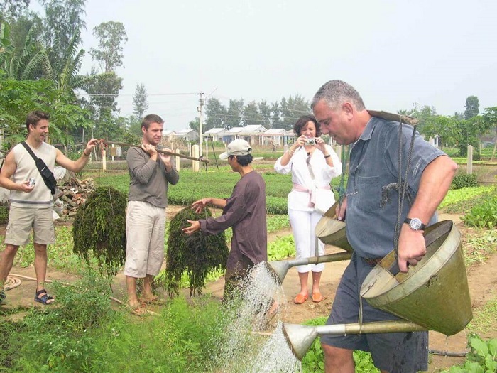 Tourists visit Tra Que Village